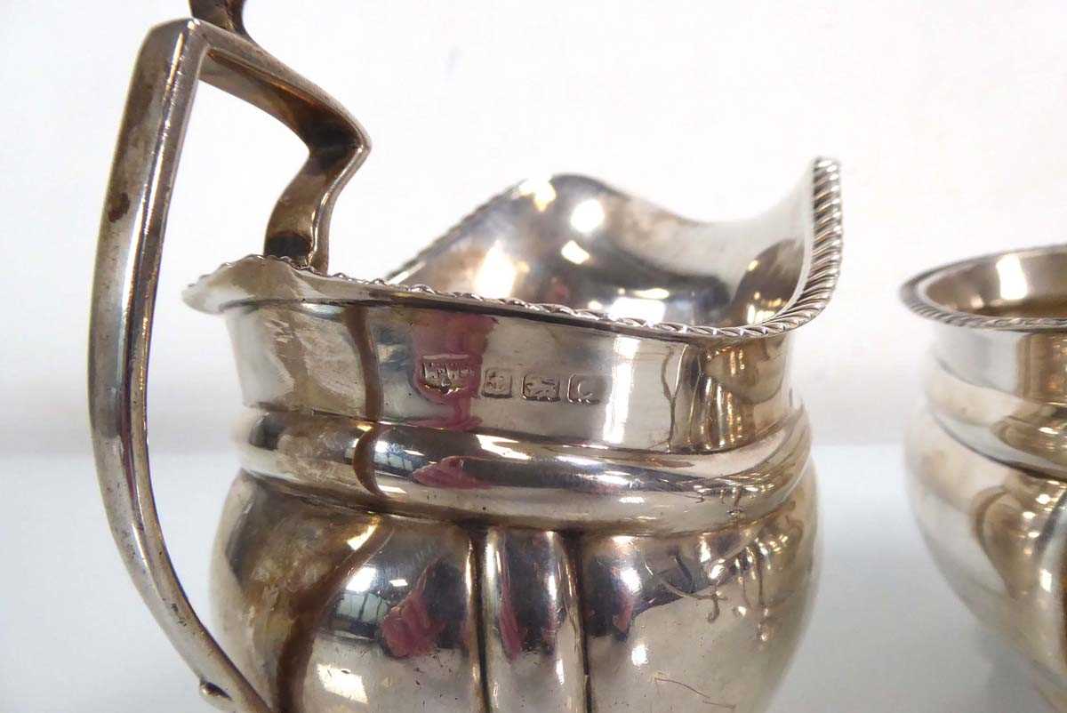 An early 20th century silver two handled sugar bowl with gadrooned decoration, together with a - Image 3 of 4