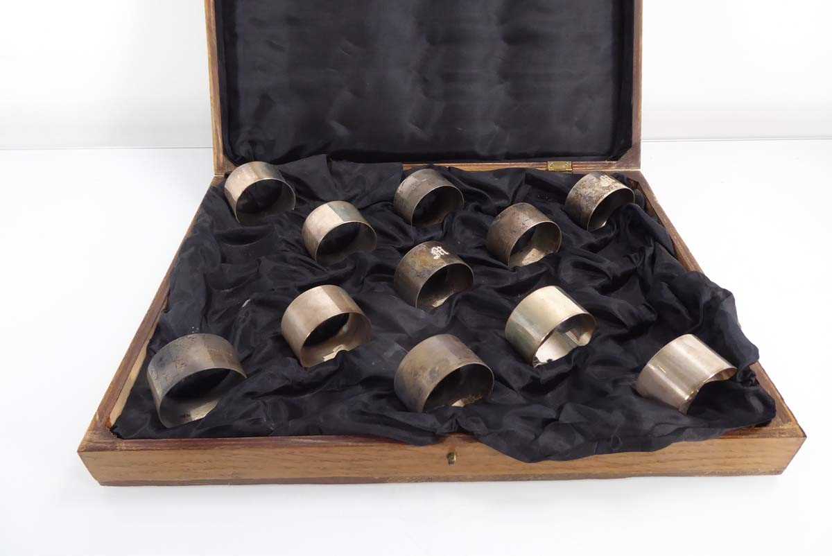 A set of eleven silver napkin rings, London 1938, overall 9.3 ozs, housed in a case for twenty- - Image 2 of 3