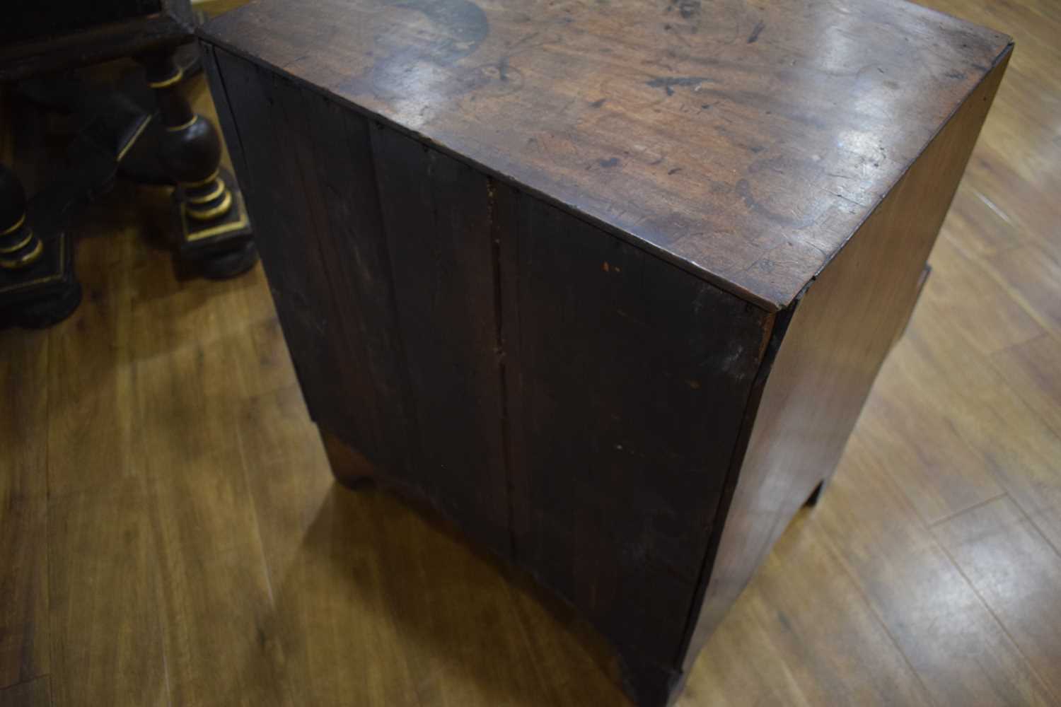 A Georgian mahogany chest of four long graduated drawers, marquetry work to the frieze, on bracket - Image 13 of 13