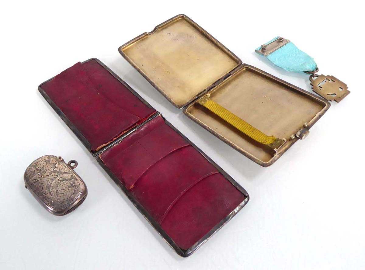 A mixed group of silver comprising a cigarette case, a vesta case, a folding purse and a National - Image 3 of 3