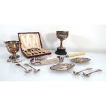 A group of silver comprising a pair of stamped oval dishes, four salt spoons, two small trophies and