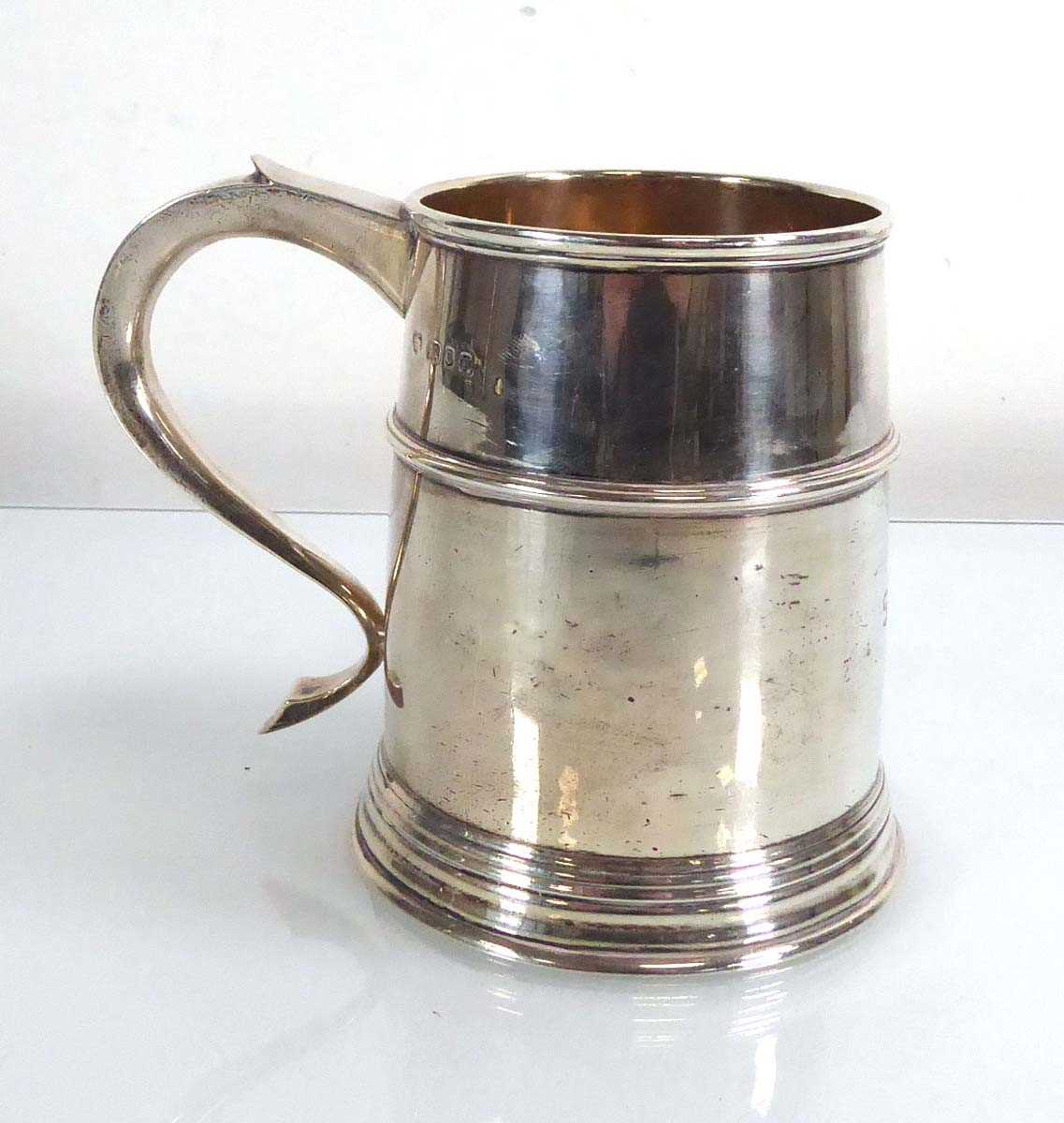 An early 20th century silver tankard of tapered form, Goldsmiths & Silversmiths Co. Ltd., 1928, h.