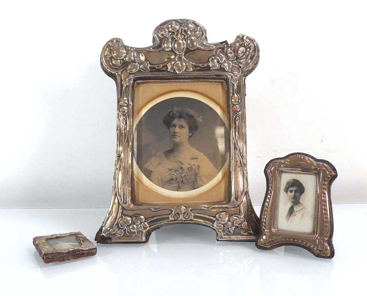 An early 20th century silver easel back photograph frame, repousse decorated in the Art Nouveau