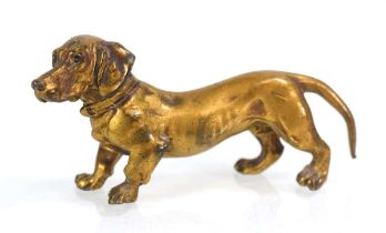 A miniature gilt metal figure modelled as a dachshund, w. 10 cm