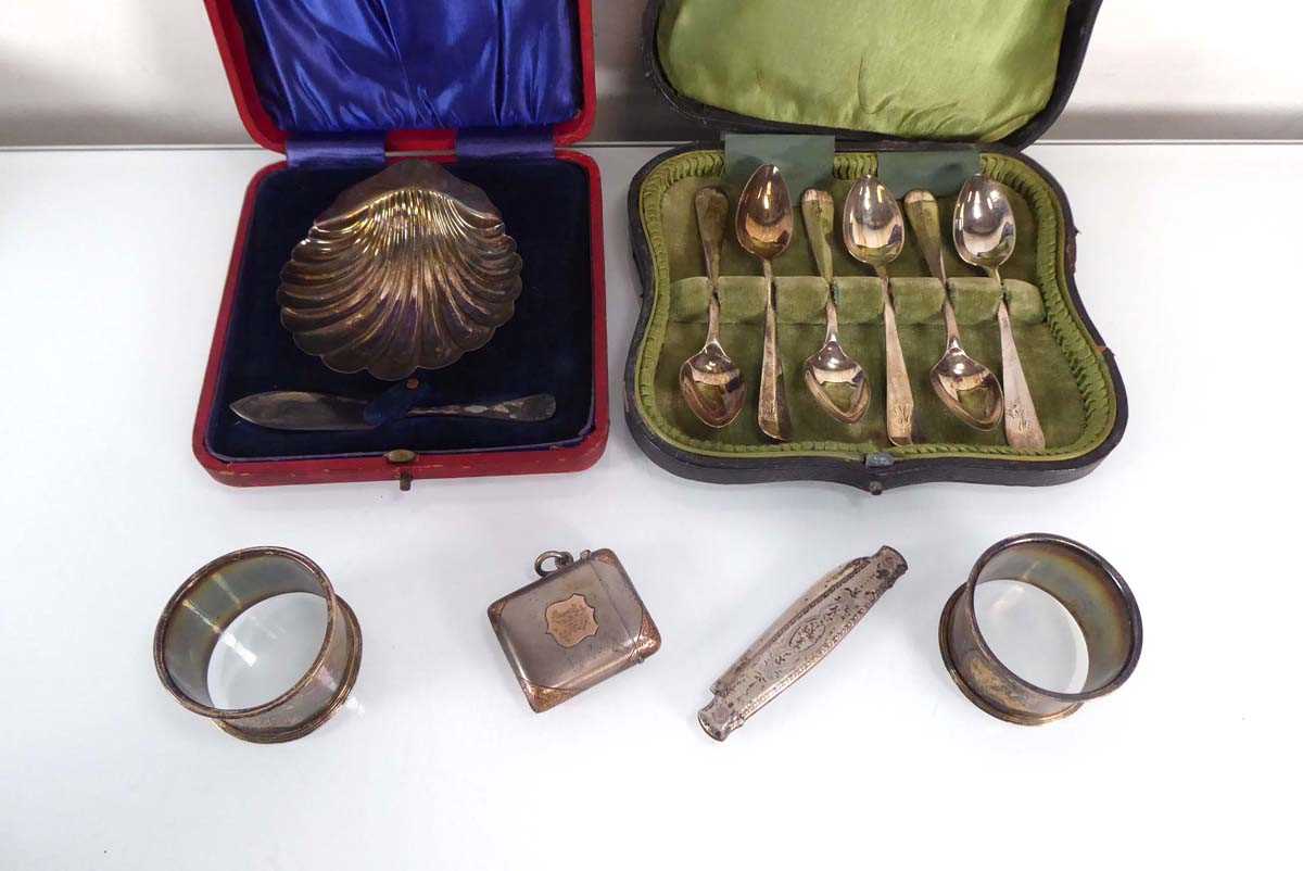 A small group of silver comprising a set of six teaspoons, a butter dish, a pair of napkin rings and - Image 2 of 2