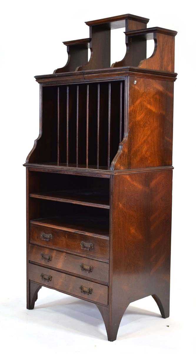 A late 19th/early 20th century rosewood music cabinet with vertical compartments over two shelves