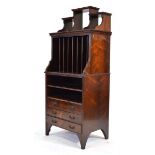 A late 19th/early 20th century rosewood music cabinet with vertical compartments over two shelves