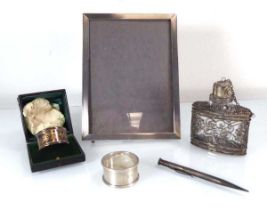 A group of silver comprising an engine turned easel back photograph frame, maker S&M, Birmingham