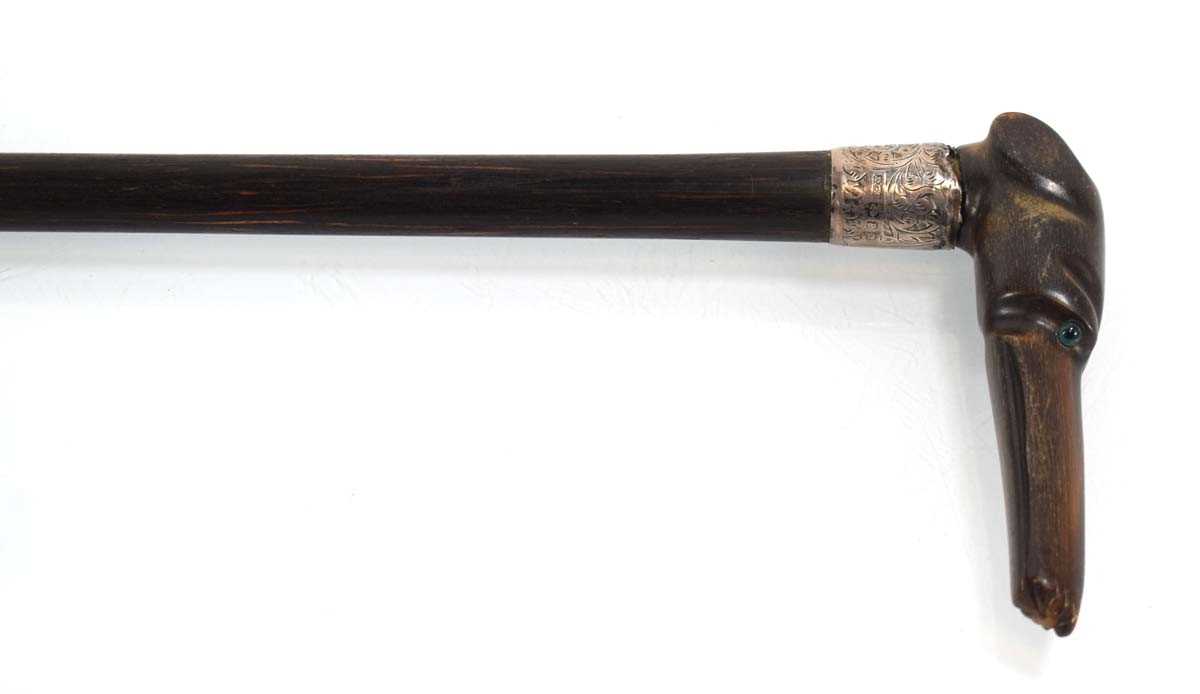 A 19th century silver-mounted walking stick with a horn handle modelled as a hound