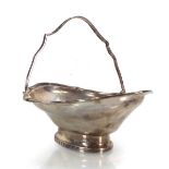 An early 20th century silver basket of oval form with swing handle, maker CS&HS, London 1920, h.14.5