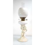 A Copelands China oil lamp with a figural column, white opaline reservoir and matching shade