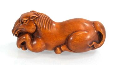 A late 20th century carved boxwood okimono modelled as a horse