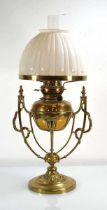 A Victorian brass oil lamp by Hinks & Son with an opaline glass shade, h. 65 cm