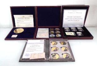 A set of five Datestamp Specimen Year set coins for 2021, a large gilt metal medallion commemorating