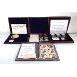 A set of five Datestamp Specimen Year set coins for 2021, a large gilt metal medallion commemorating