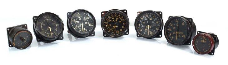 A group of Second World War Air-Ministry instruments including airspeed indicators, boost gauge etc.