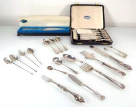 A mixed group of silver flatware comprising a cased set of six butter knives, a cake slice, three