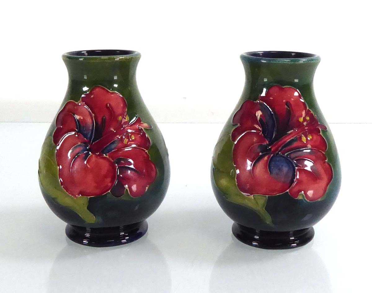 A pair of miniature Moorcroft vases, each decorated with hibiscus on a green ground, h. 9.5 cm (2) - Image 2 of 4