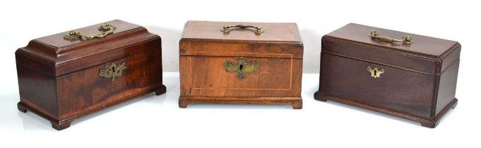 A group of three mahogany and walnut Georgian caddies/desk boxes on bracket feet (3)