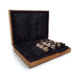 A set of eleven silver napkin rings, London 1938, overall 9.3 ozs, housed in a case for twenty-