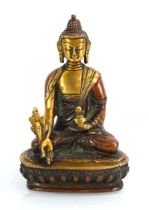 A late 20th century Tibetan lacquered gilt bronze figure modelled as Medicine Buddha, h. 15 cm