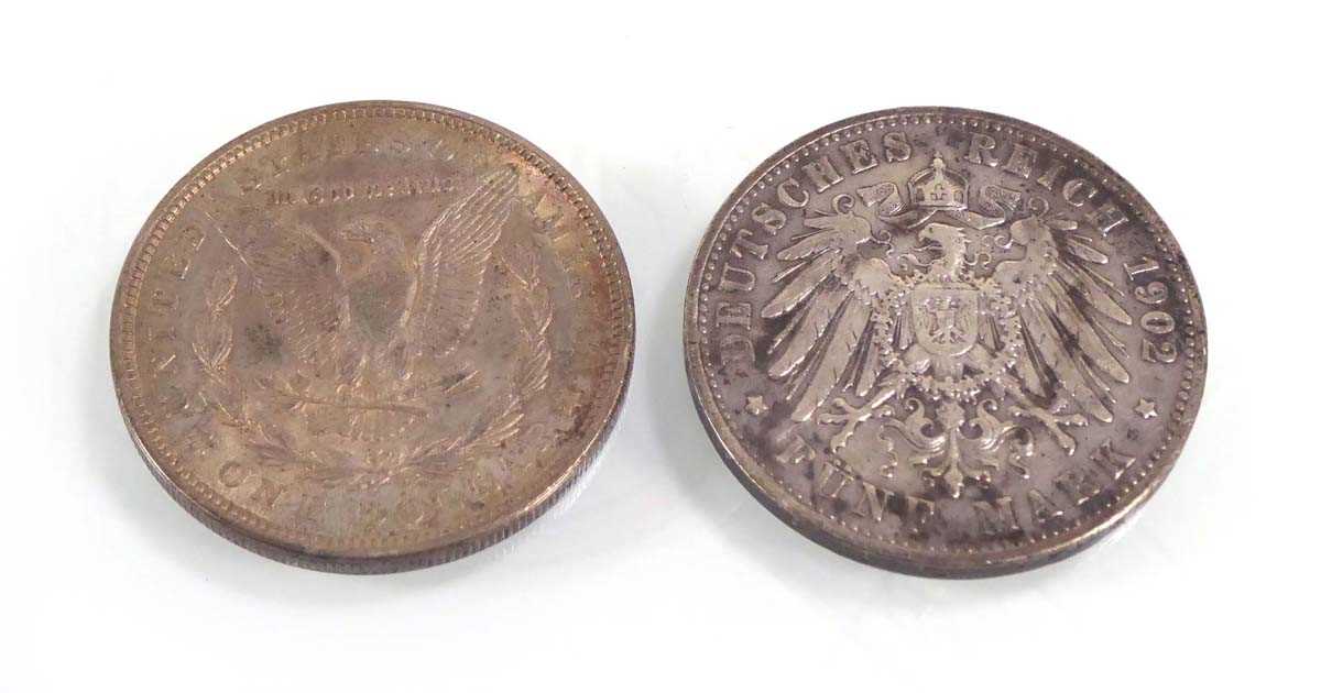 An American dollar dated 1921 and a Wilhelm II 5 mark coin dated 1902 (2)