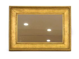 A rectangular giltwood wall mirror, 80 x 112 cm The aperature for the mirror is 21 x 33 inches.