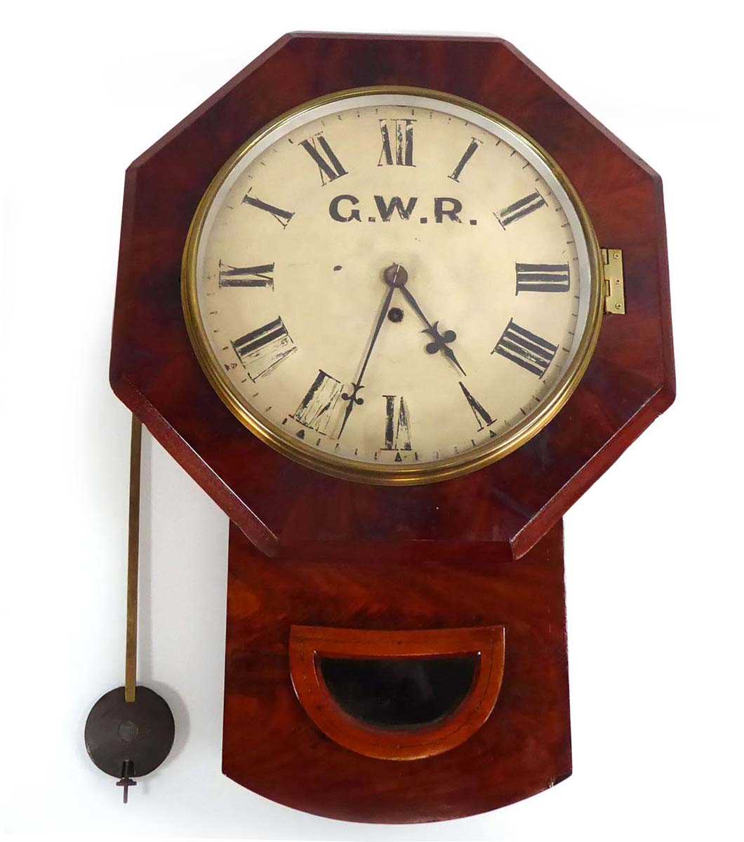 A late 19th/early 20th century drop dial wall clock, the dial painted with GWR initials and black