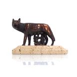 A 20th century bronzed figure modelled as the 'Capitoline Wolf' on a plinth base, w. 14 cm