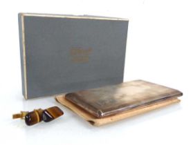A silver, parcel gilt and engine turned cigarette case of canted rectangular form, maker WHN,