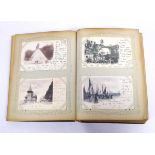 Large leatherbound album containing array of worldwide postcards primarily from 1899-1902, with some