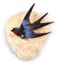 Clarice Cliff for Newport Pottery, a wall pocket relief decorated with a swallow, l. 19 cm No