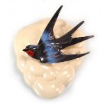 Clarice Cliff for Newport Pottery, a wall pocket relief decorated with a swallow, l. 19 cm No