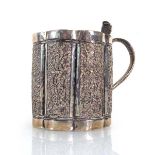 An Anglo-Indian metalware Christening mug of scalloped form with serpent handle, h. 8 cm, 3.1 ozs