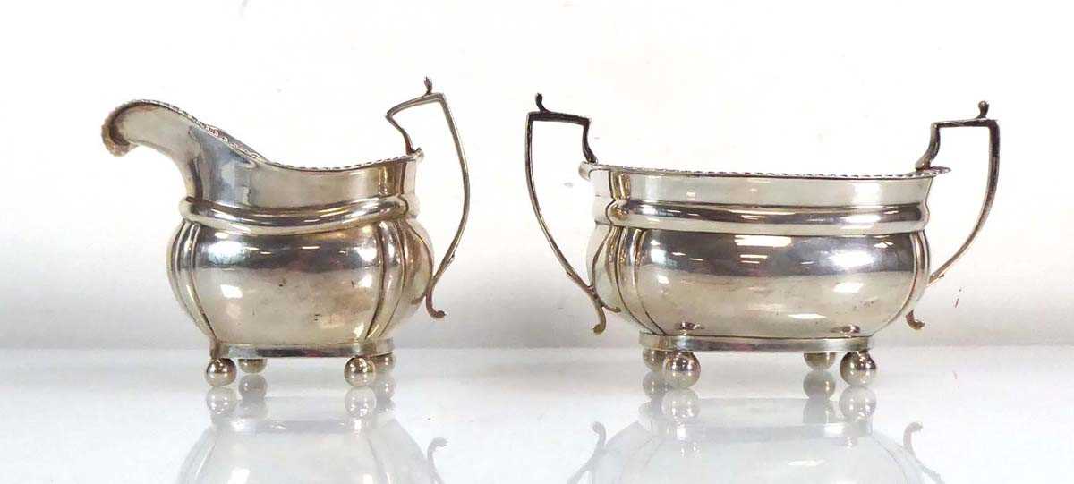An early 20th century silver two handled sugar bowl with gadrooned decoration, together with a - Image 2 of 4