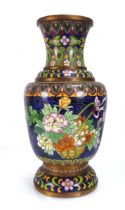A late 19th century clossoine vase decorated with flowering shrubs and geometric bands, h. 31 cm