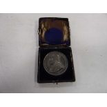 A cased Papal commemorative medallion