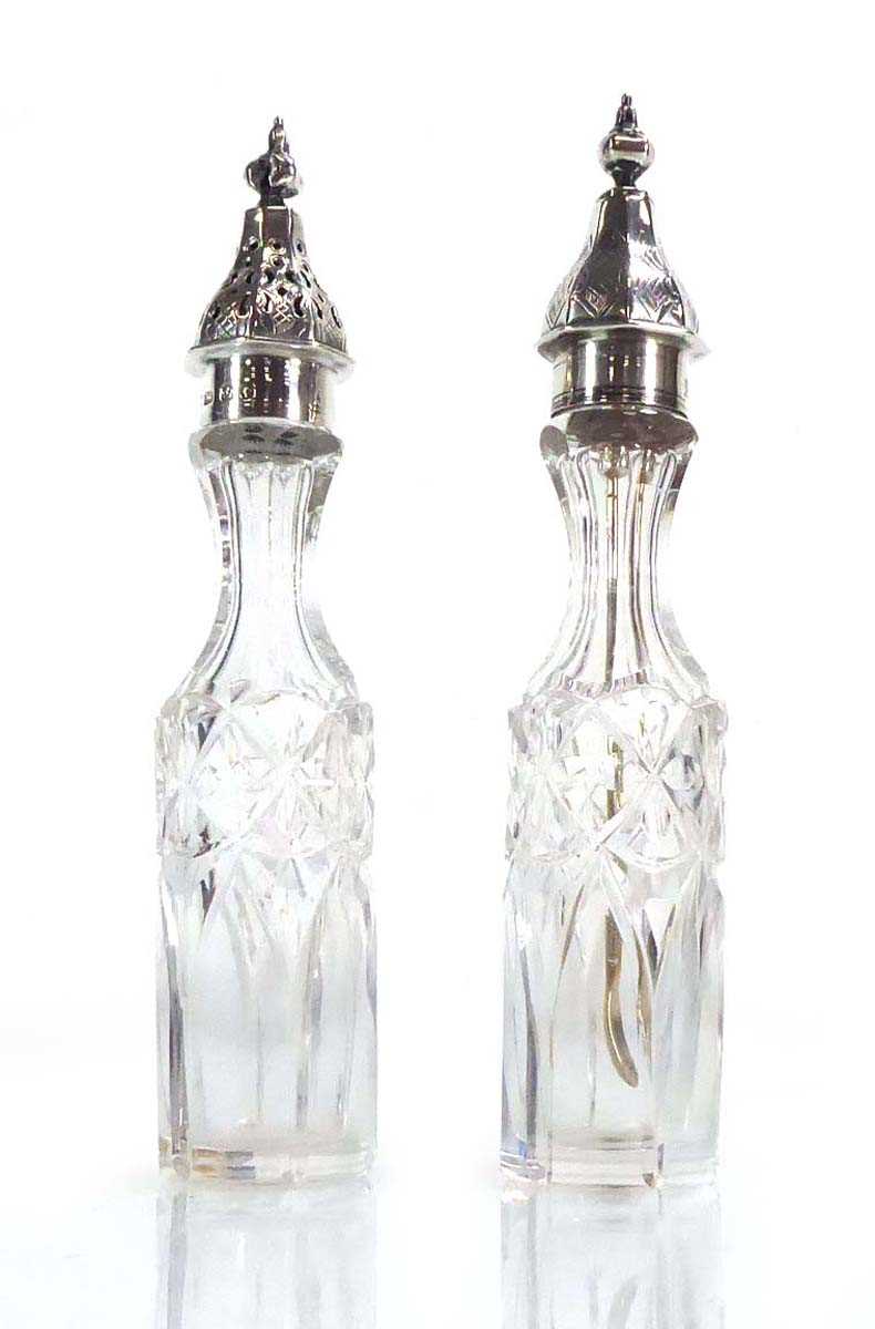 A pair of Victorian silver mounted cruet bottles, hallmarks indistinct, h. 17 cm (2) Splits and