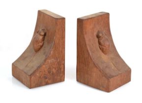 A pair of Robert 'Mouseman' Thompson carved oak bookends, each with a mouse climbing up the side, h.