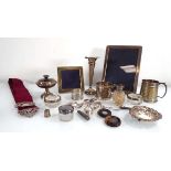 A mixed group of silver including two Christening mugs, two photograph frames, a set of six