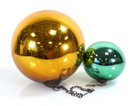 Two decorative 'witches balls' in yellow and green, di. 23 cm and 14 cm (2)