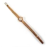 A ladies 9ct yellow gold wristwatch by Certina, the circular dial with Arabic and baton numerals