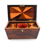 A 19th century mahogany and satinwood strung tea caddy of sarcophagus form, the interior of the