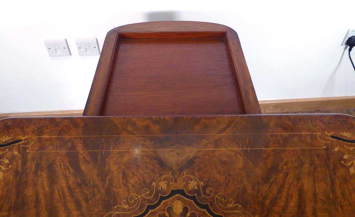 A Victorian figured walnut and marquetry games table on four turned columns and splayed legs with - Image 4 of 5