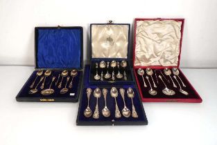 A set of six Edwardian silver gilt foliate handled teaspoons, a pair of matching sugar tongs and a