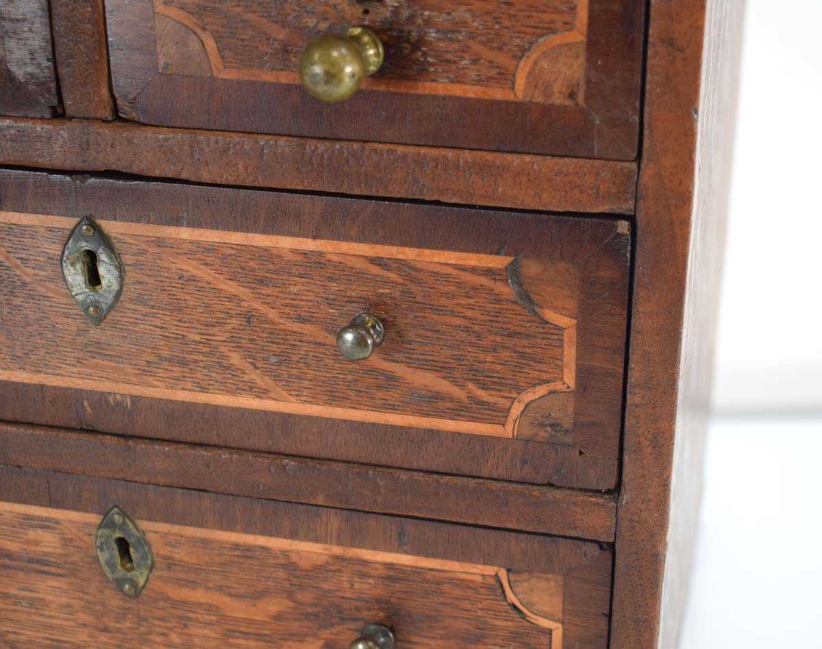 An apprentice chest of two short over three long graduated drawers, the mahogany body with satinwood - Image 4 of 10