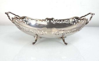 An early 20th century silver two handled basket of oval on four scrolled feet, W&R Sorley, Sheffield
