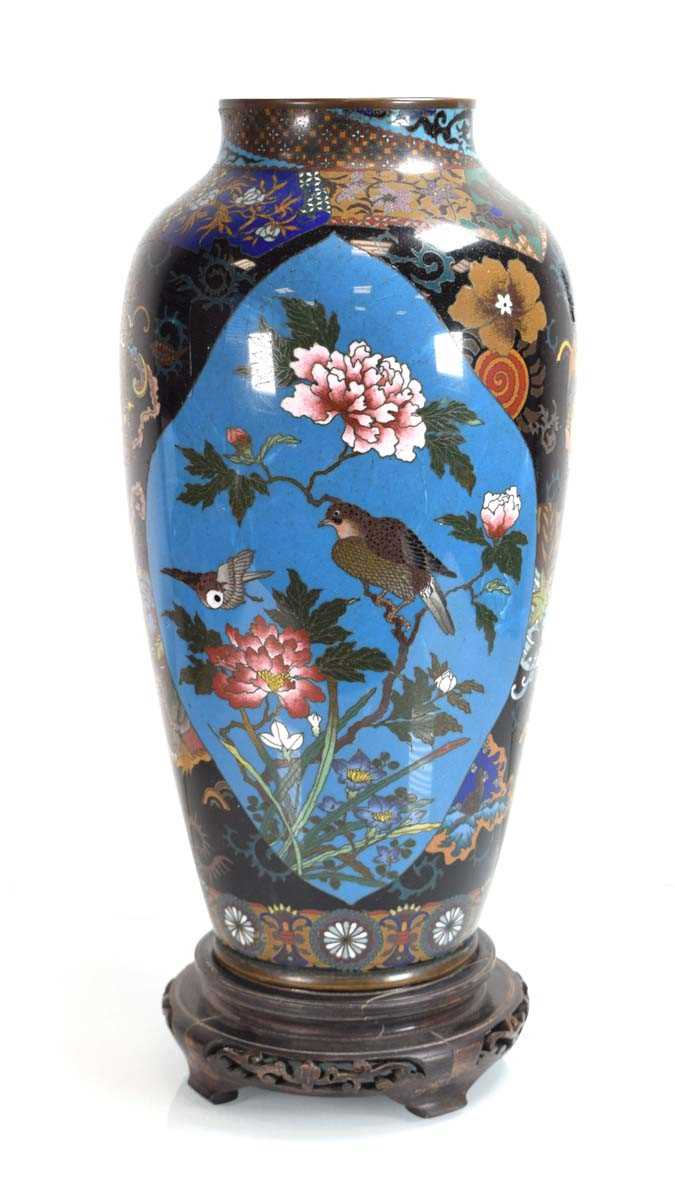 A late 19th century cloisonné two-panelled vase, h. 38 cm, on an associated stand