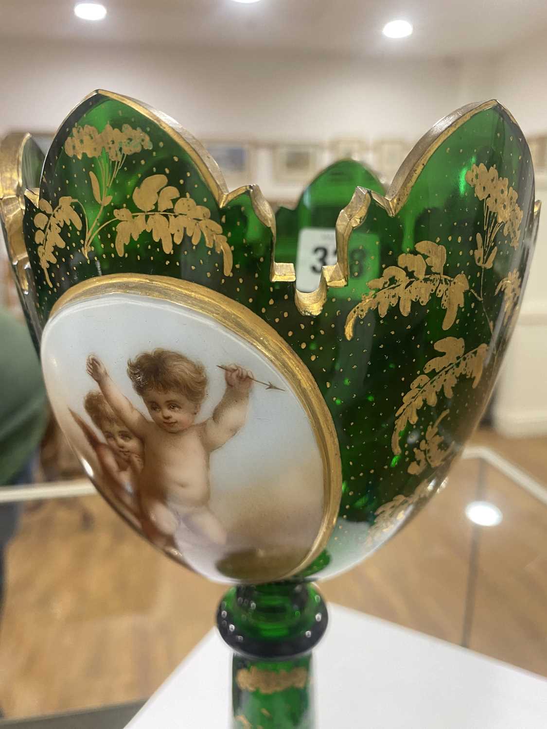 A Bohemian green glass vase of goblet form decorated with a pair of putti within a gilt fern - Image 5 of 26