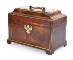 A late 18th/early 19th century mahogany and brass mounted box of casket form with bracket feet,